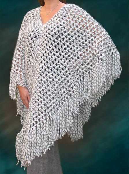 Crocheted in Rowan Big Wool Mistletoe is a wonderfully warm poncho for